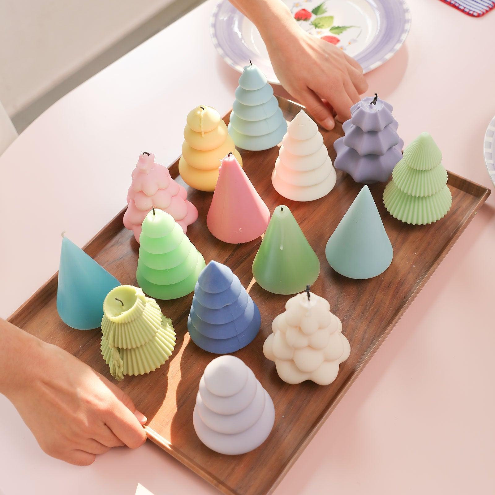 Christmas tree candles of various colors and shapes placed on a tray-Boowan Nicole