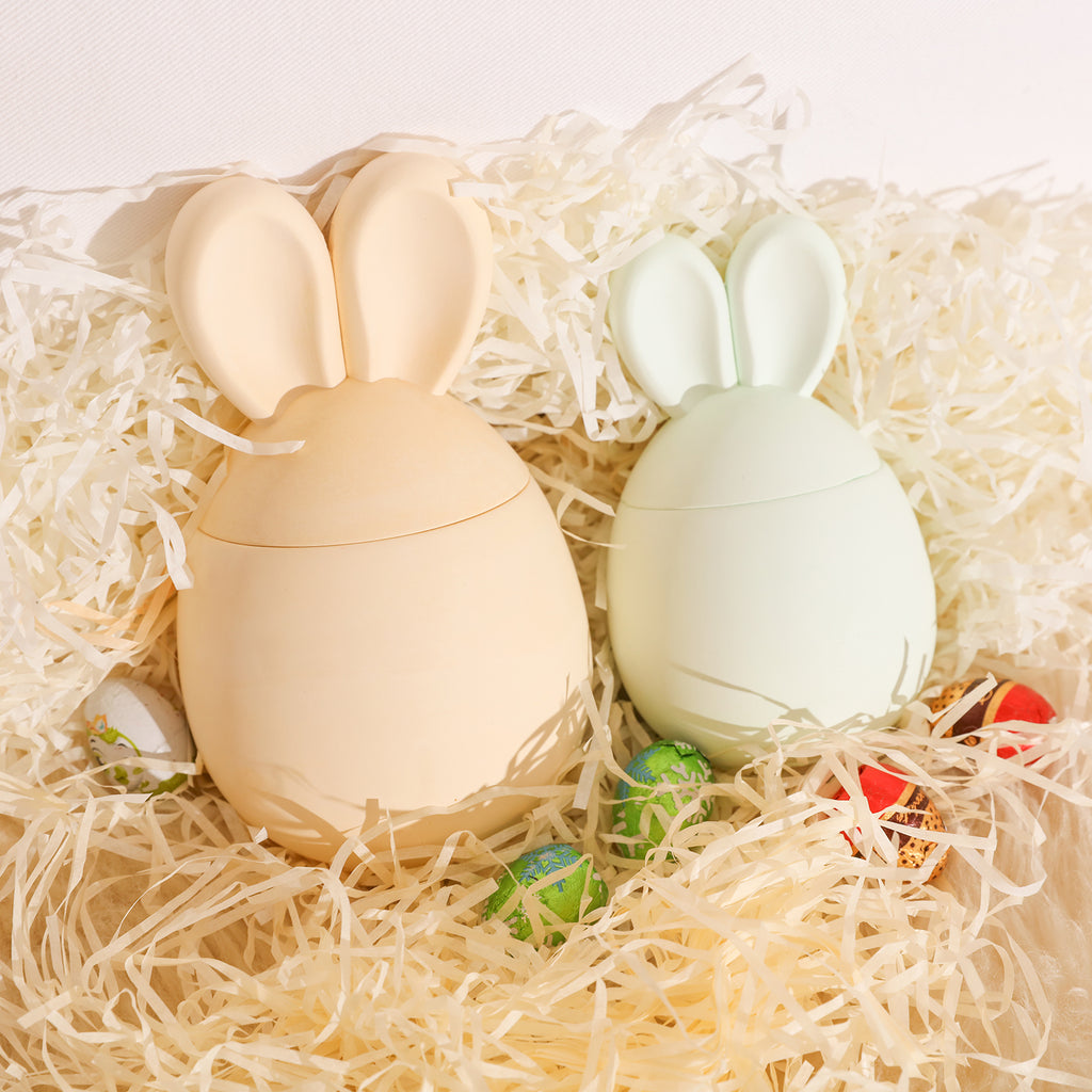 Two Easter Bunny candle jars placed in gift box