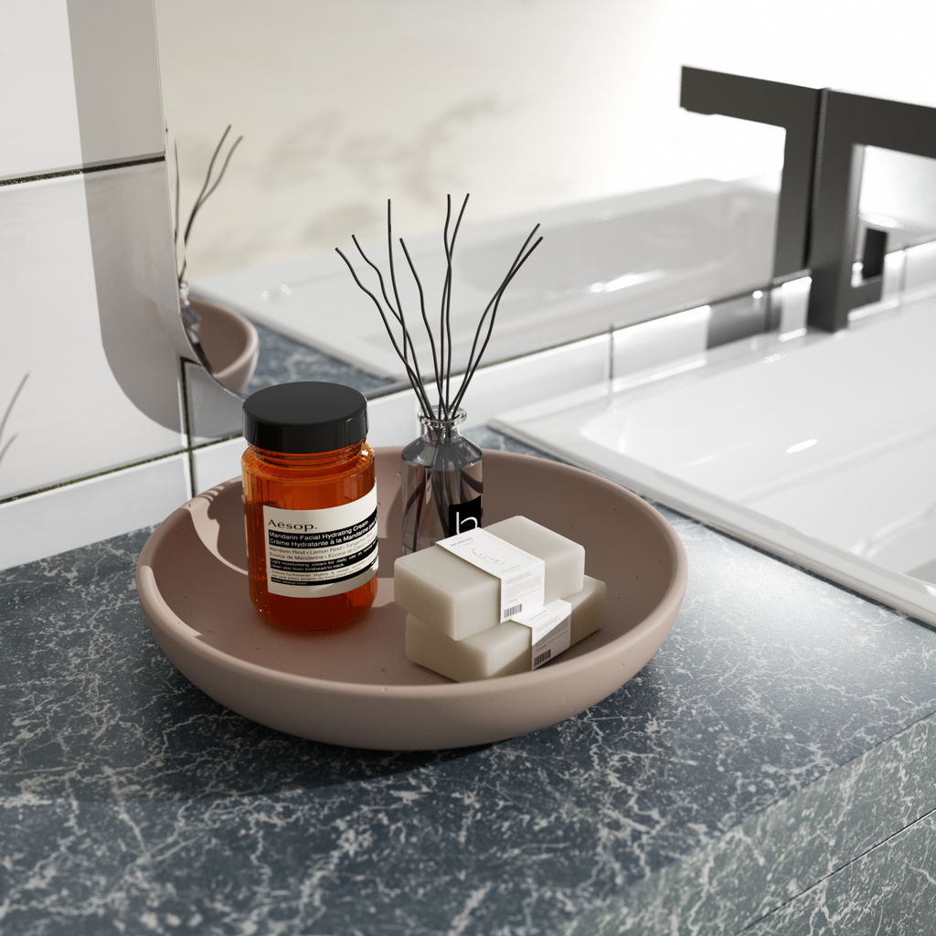 A large round tray placed on the bathroom sink contains soap, smokeless aromatherapy and personal toiletries, adding a sense of ritual to life.