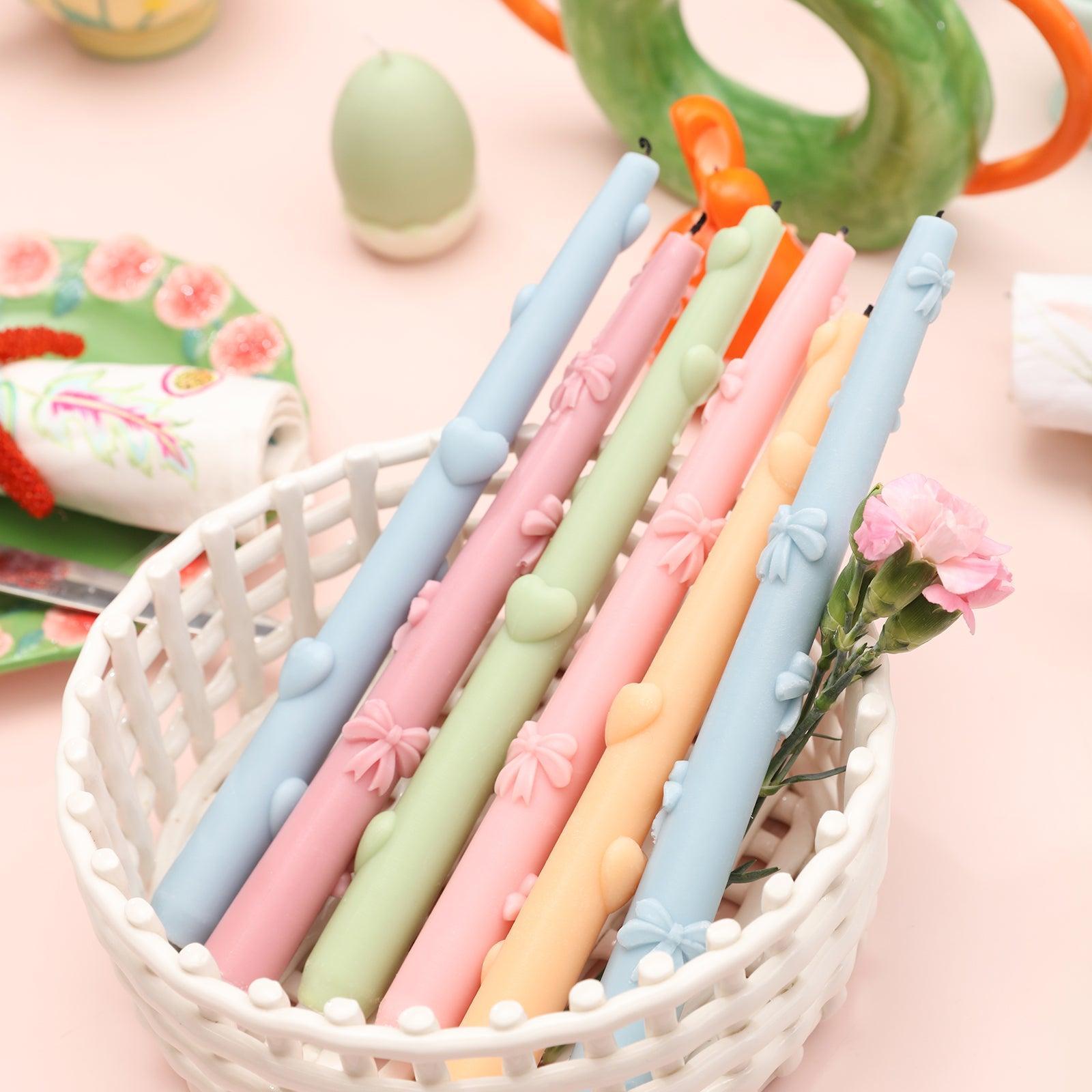 Creatively arrange completed Love Heart Taper Candles in a plastic basket, ready to enhance any space.