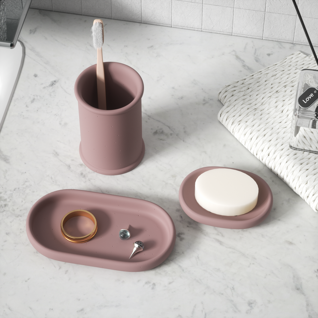 Next to the sink, the purple Minimalist Oval Tray Silicone Mold holds rings and earrings. Next to it are a purple cup holding toothbrushes and a purple soap dish - Boowan Nicole