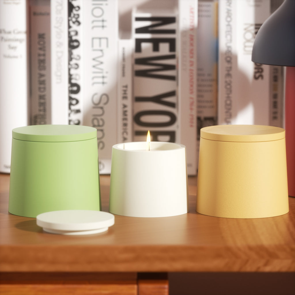 The yellow, green, and white Simple Style Small Candle Jar is placed on the table, and the candle in the white Candle Jar is slowly burning-Boowan Nicole