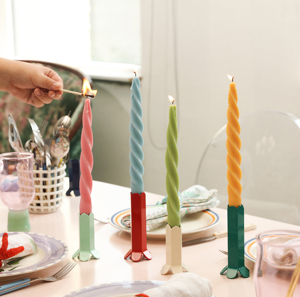 Spiral taper candles crafted with Boowannicole silicone molds, lit and elegantly displayed as decorations on the table