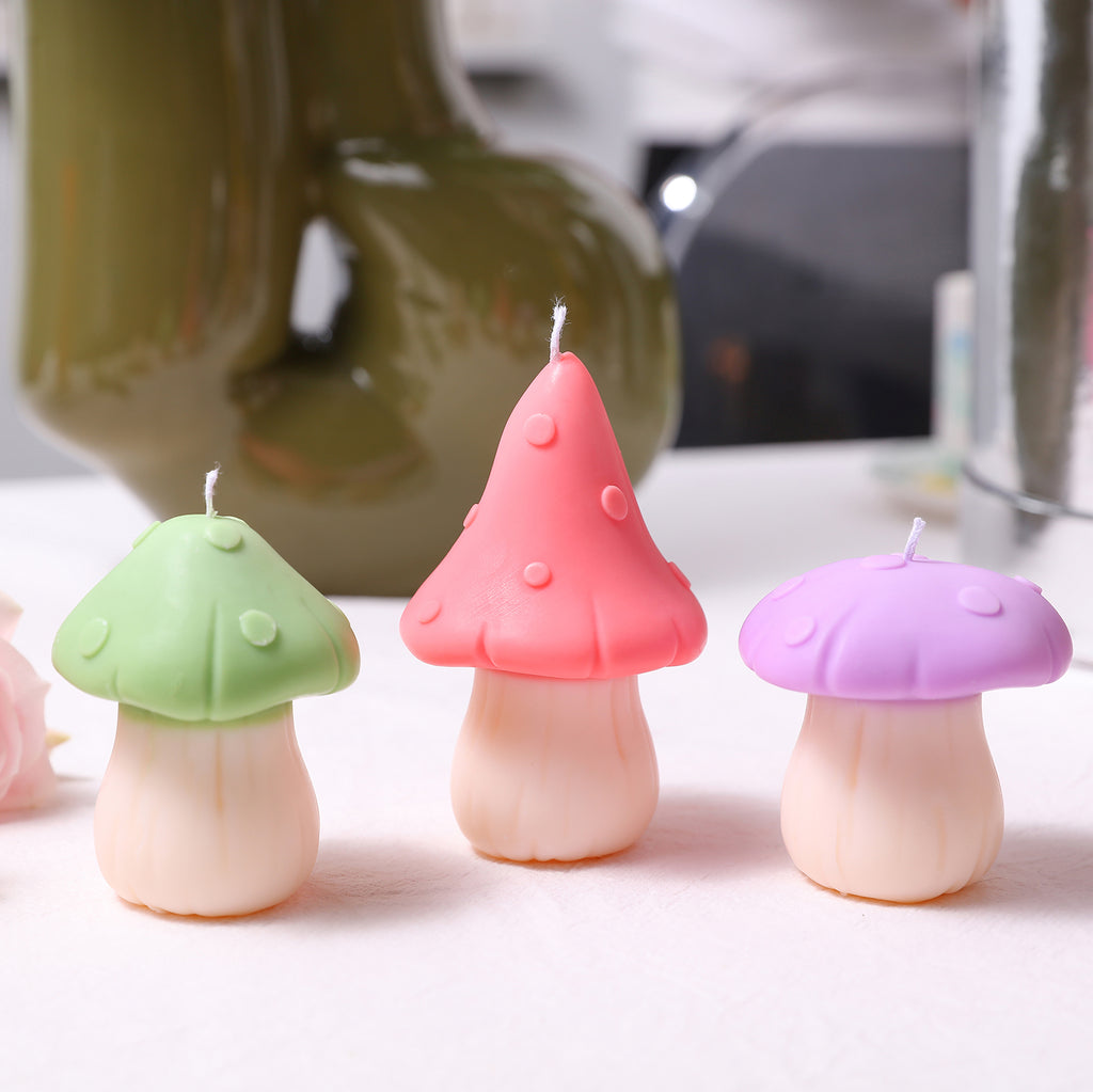 Three mushroom-shaped candles with canopies in different colors are placed on the dining table, adding to the festive atmosphere, designed by Boowan Nicole.