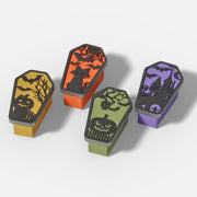 Set of four Halloween-themed coffin-shaped candle jars with spooky embossed lids featuring pumpkins, bats, cats, skulls, and haunted houses - Boowan Nicole