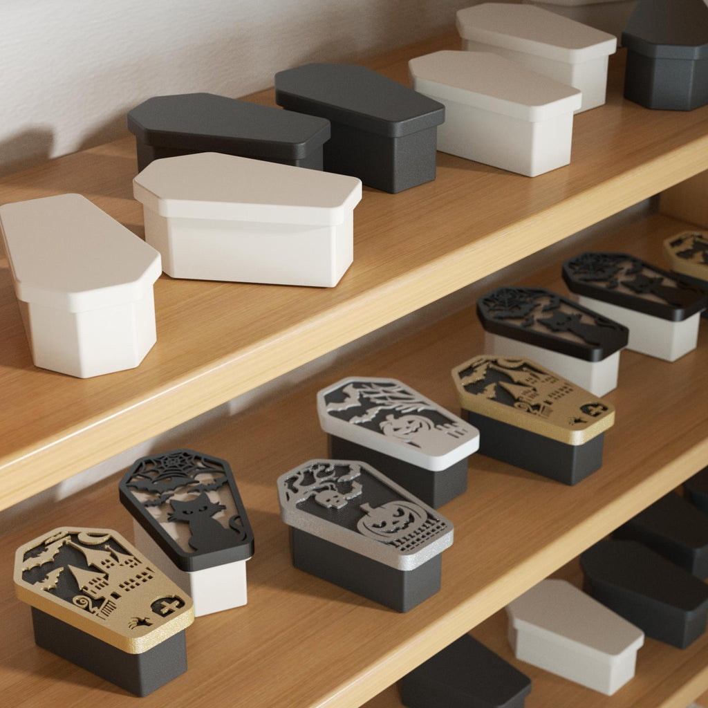 Handcrafted Halloween coffin candle jars in small-batch display with spooky embossed lids - Boowan Nicole