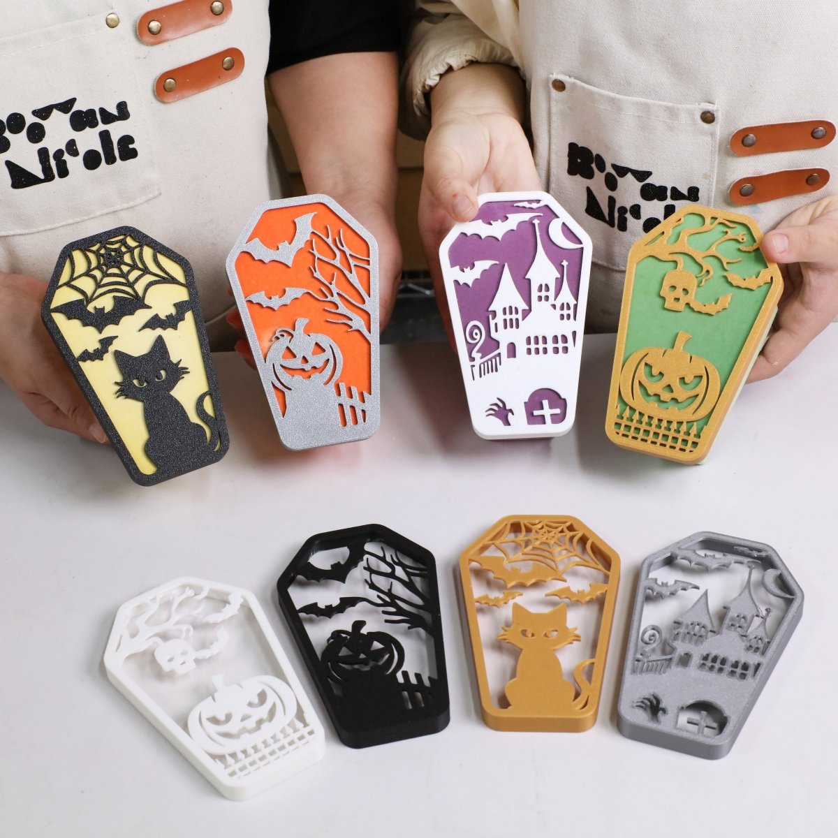 Halloween coffin candle jars with embossed spooky designs in assorted colors - Boowan Nicole