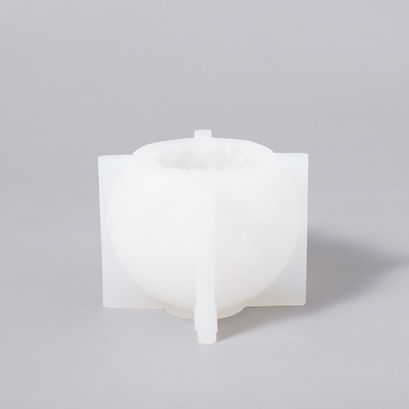 White sphere patterned relief candle silicone mold for easy and efficient crafting.
