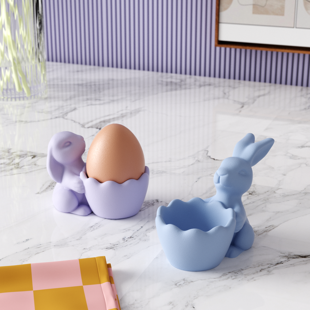 Two blue Easter bunny egg cups placed on the table