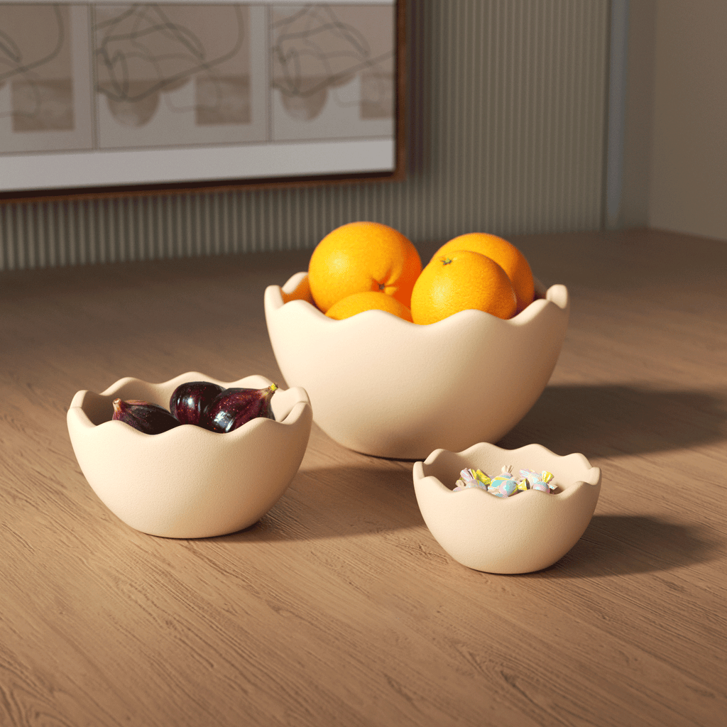 Three eggshell bowls of different sizes placed on the table