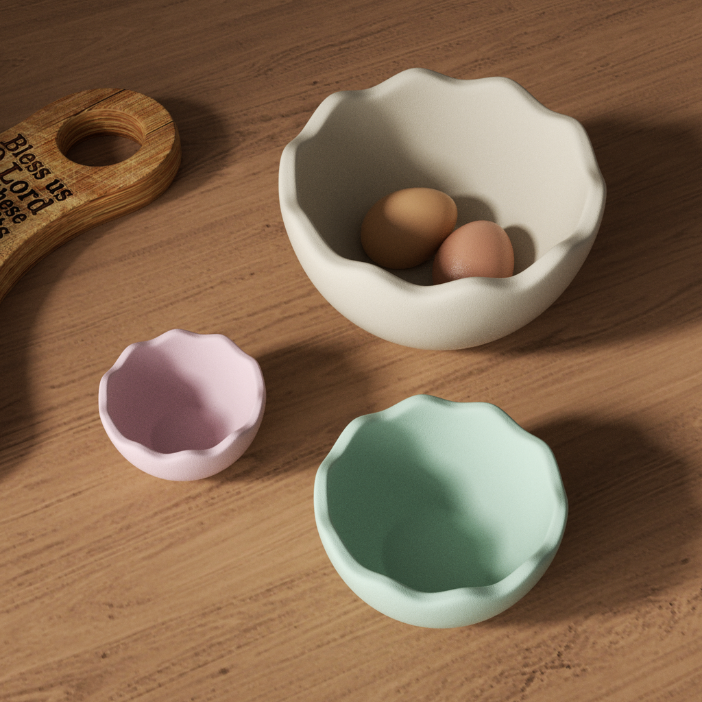 Three eggshell bowls of different sizes, one containing eggs