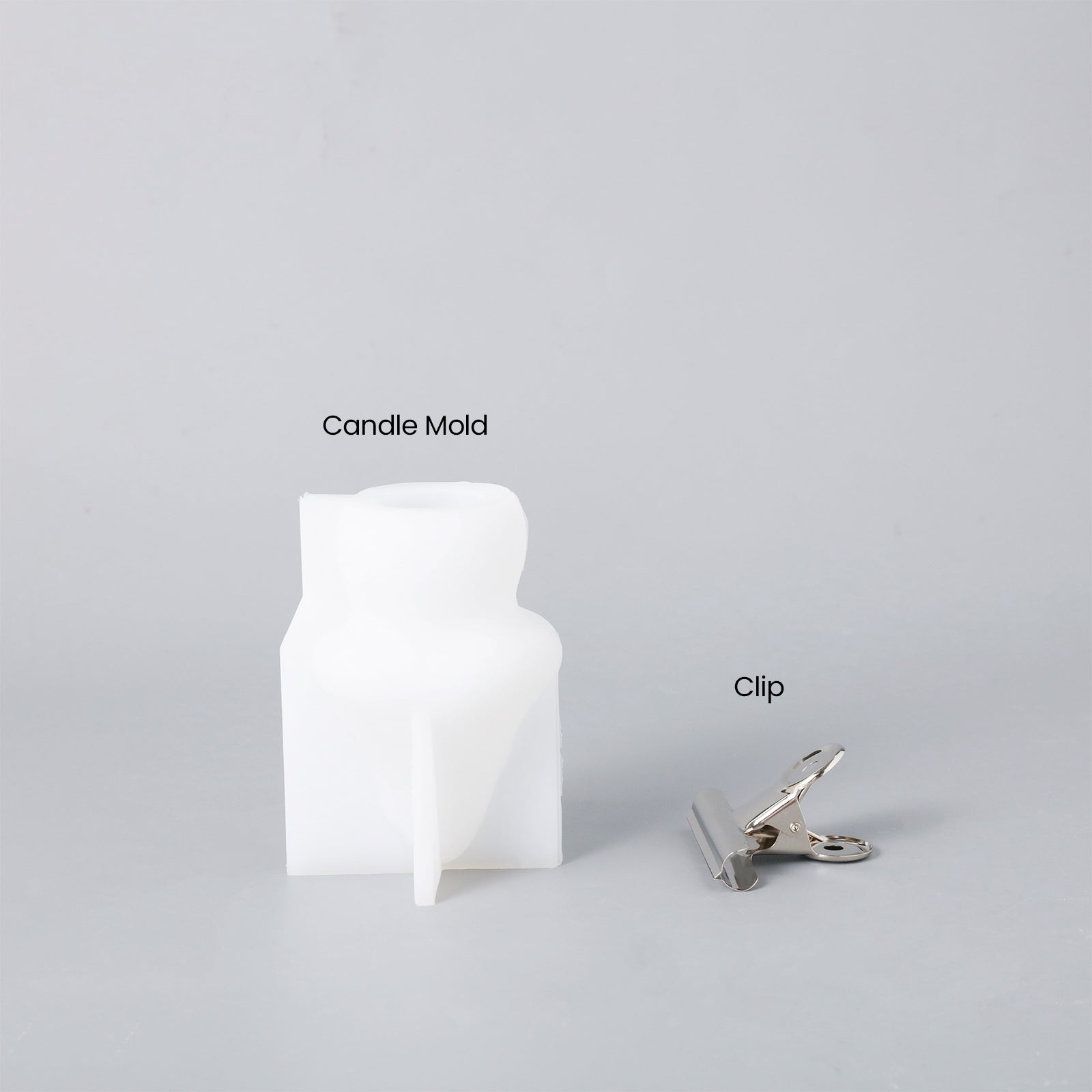 White silicone molds and clips for making mushroom candles, designed by Boowan Nicole.