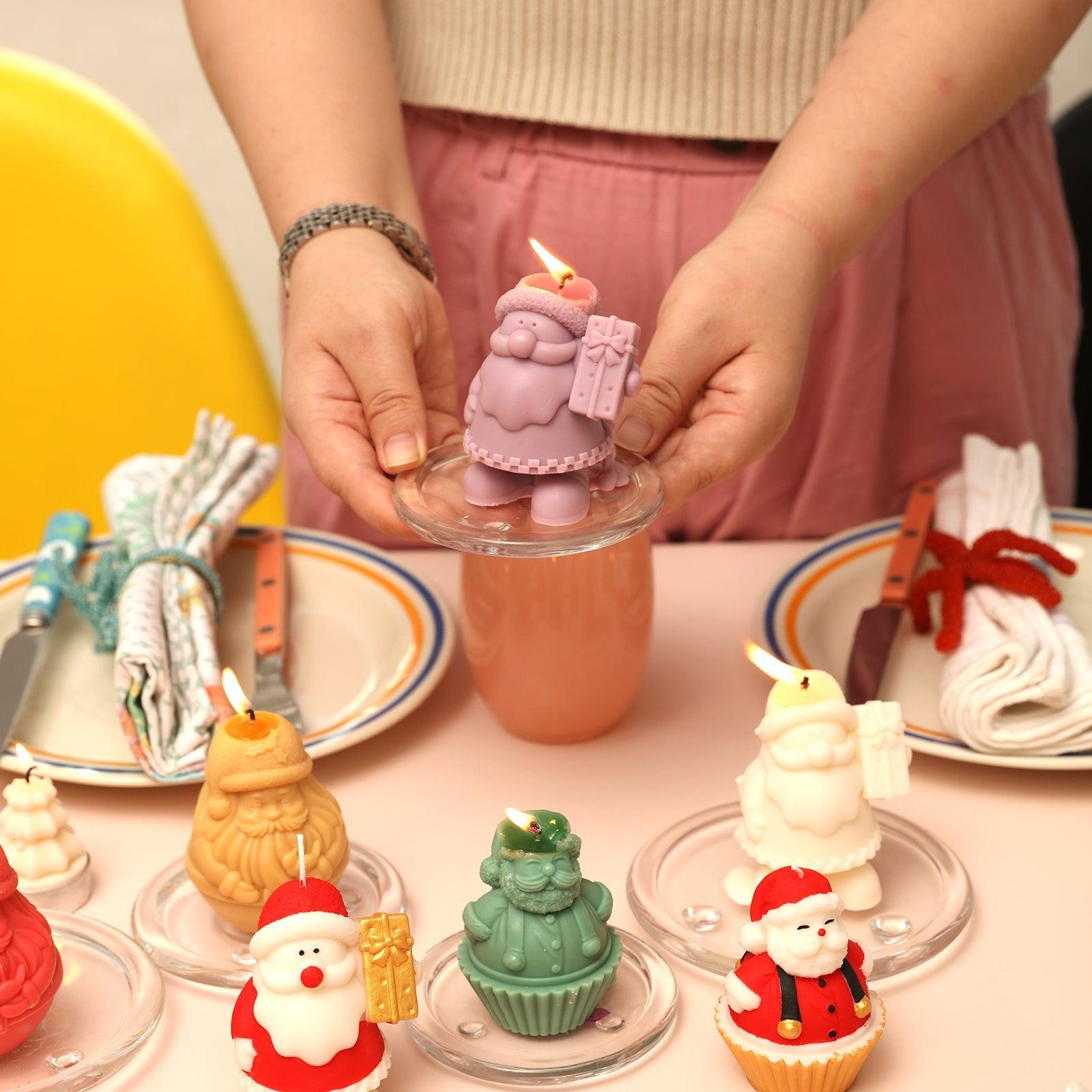 Purple Gift-Giving Santa Claus Candle being lit in a handheld glass tray-Boowan Nicole