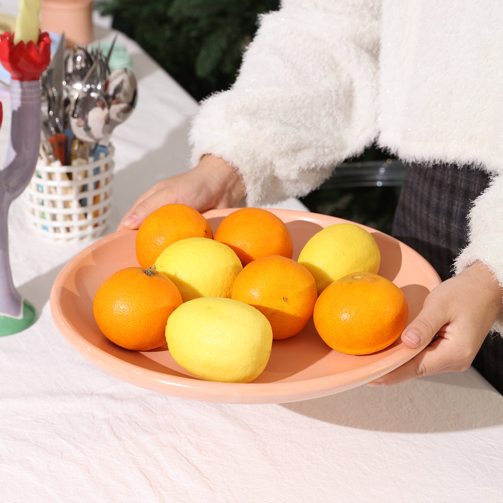 Bring the tray with the fruit to the table.