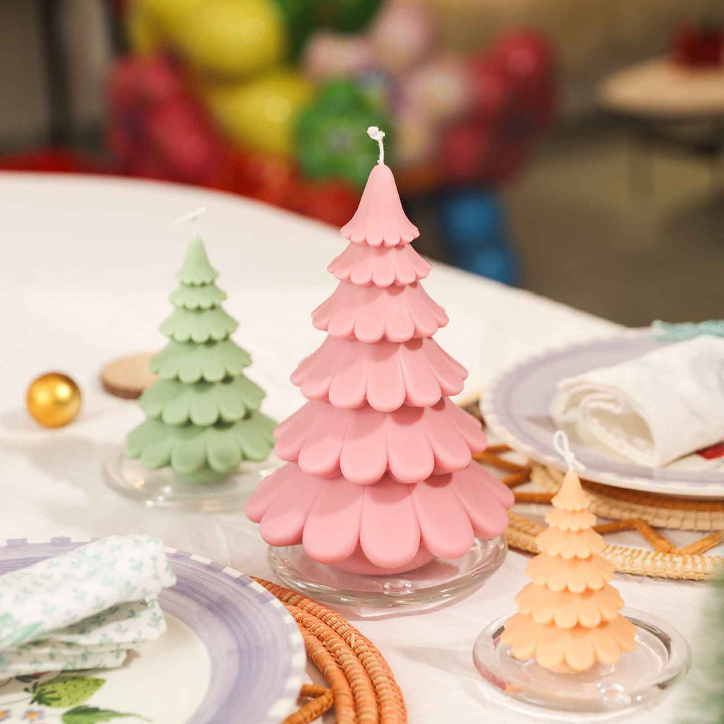 Large, medium and small tiered Christmas tree candles on a crystal tray for the dining table, designed by Boowan Nicole.