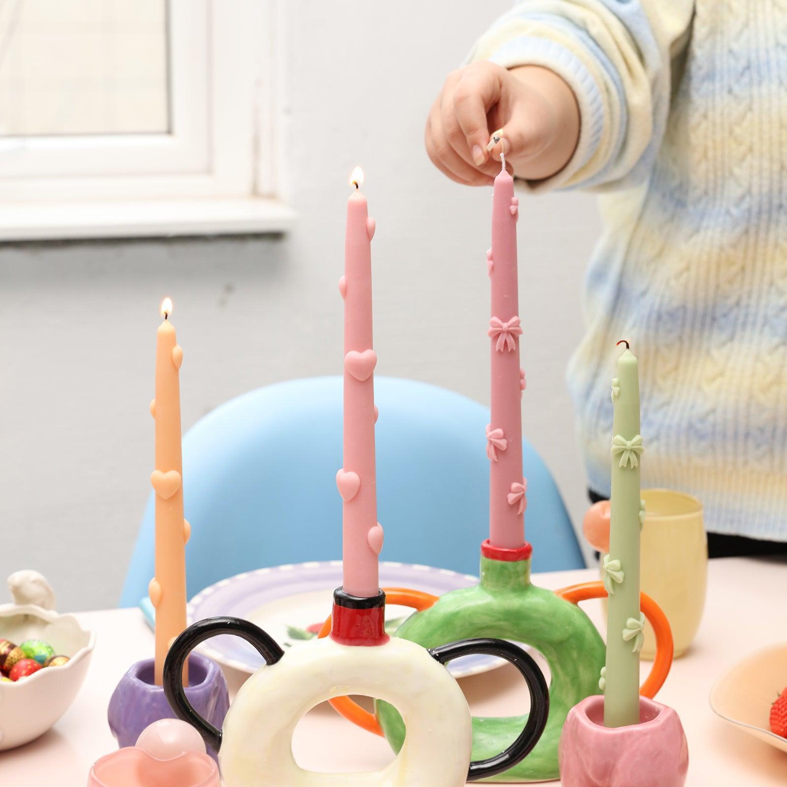  Experience the mesmerizing flicker as a Love Heart Taper Candle is elegantly ignited.