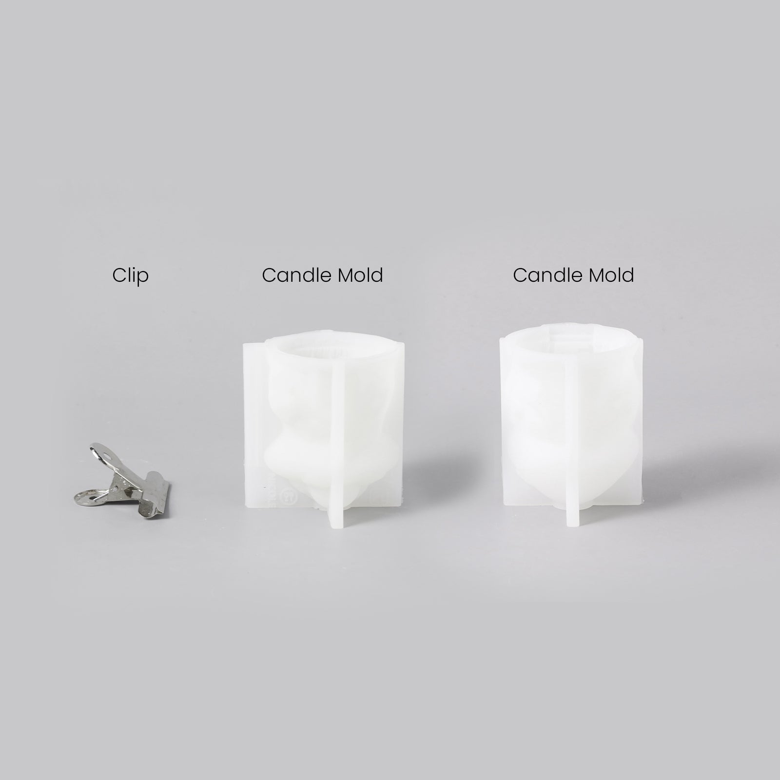 Two white silicone molds and a clip for making mushroom house candles, designed by Boowan Nicole.