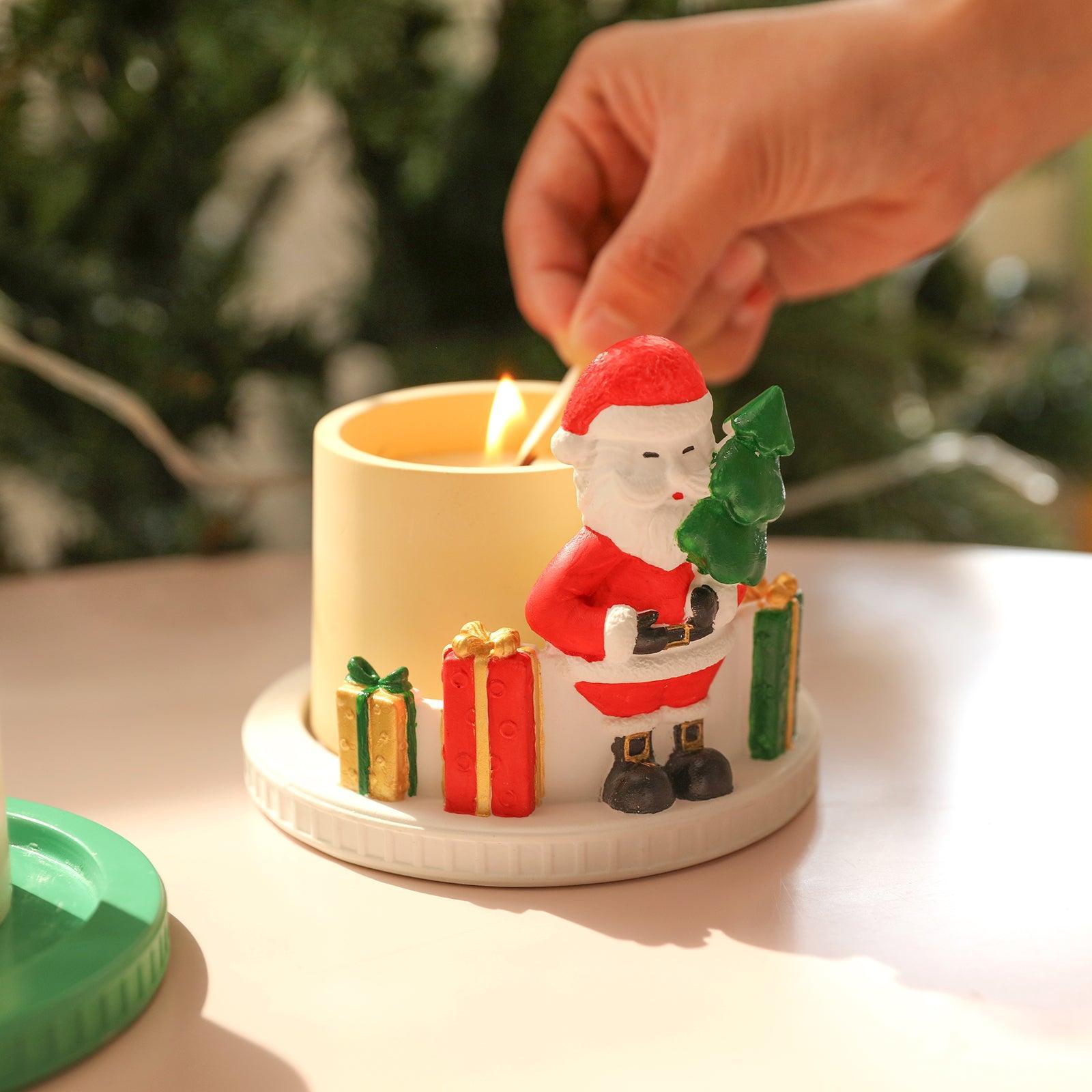 Light the candles in the candle jar in the Santa Menorah, designed by Boowan Nicole.