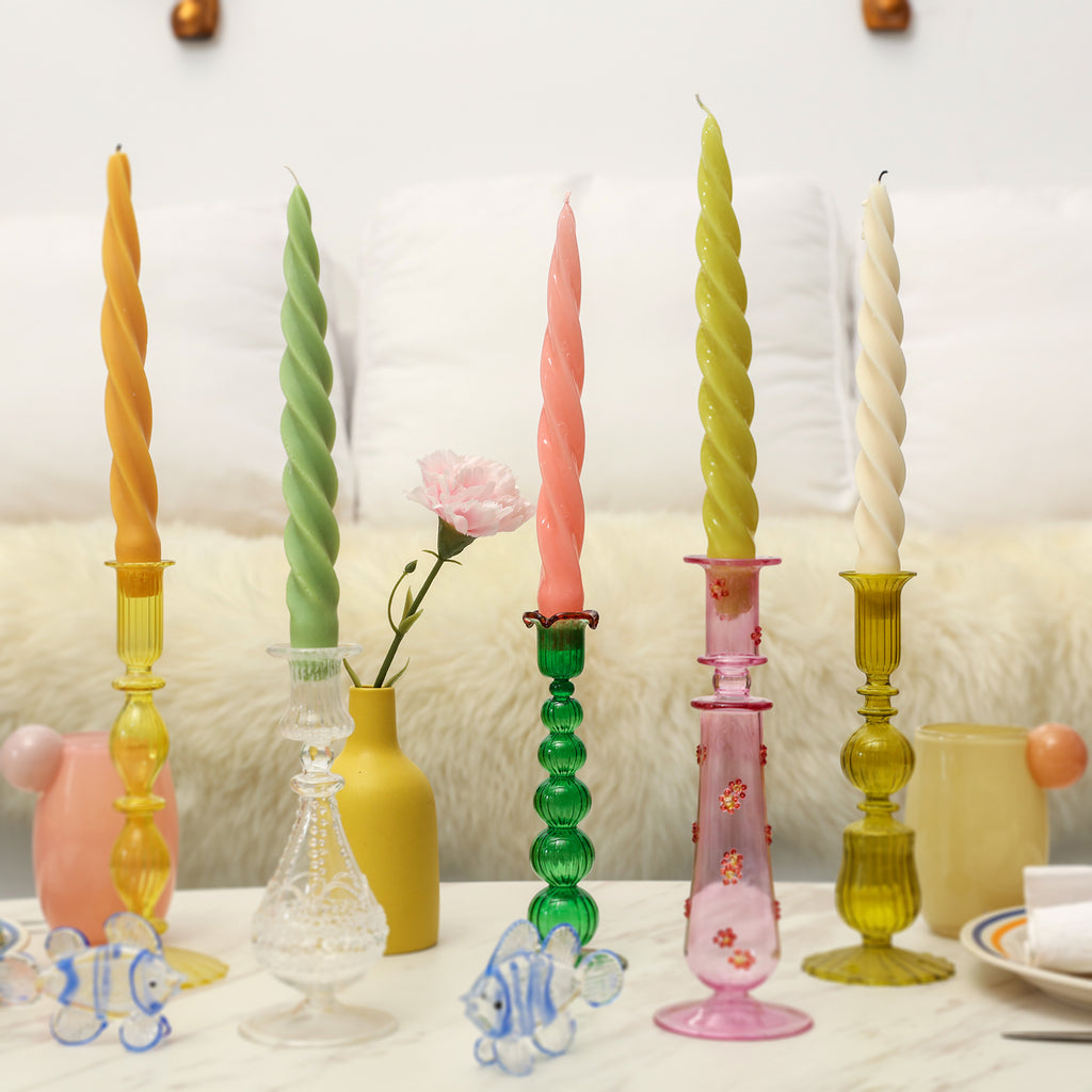Boowannicole's Taper Candle Ensemble - Elevate your decor with this set of five taper candles elegantly arranged on a stylish candle holder, creating a warm and inviting atmosphere.