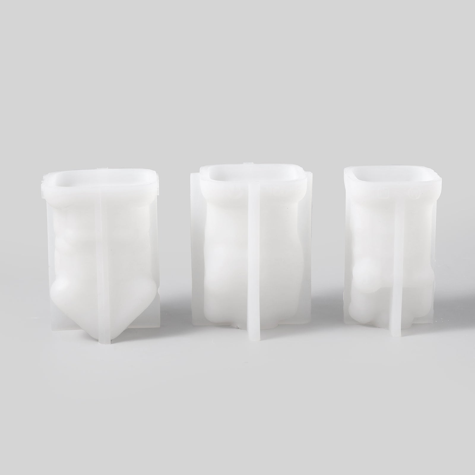 Three different silicone molds for making house candles.