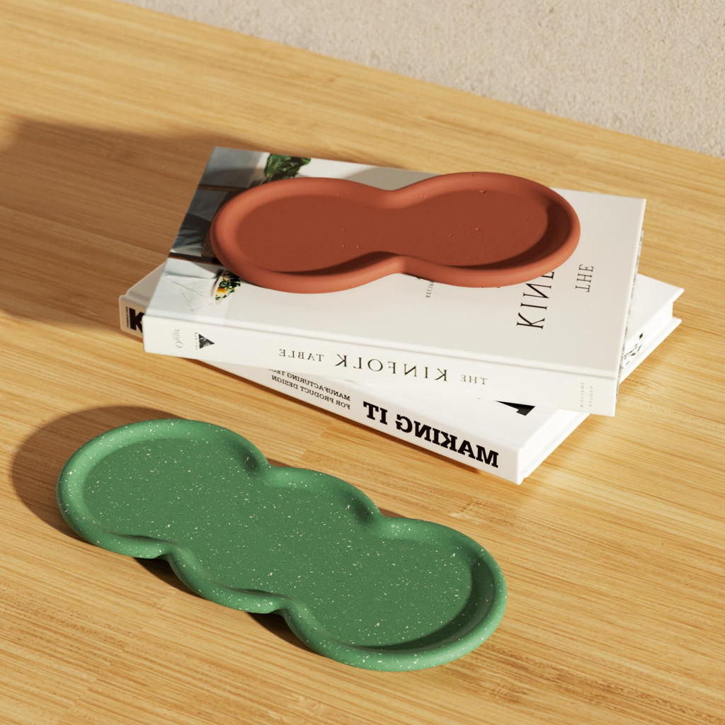 Green Triple-Nut Peanut-Shaped Tray-Boowan next to the book on the table Nicole