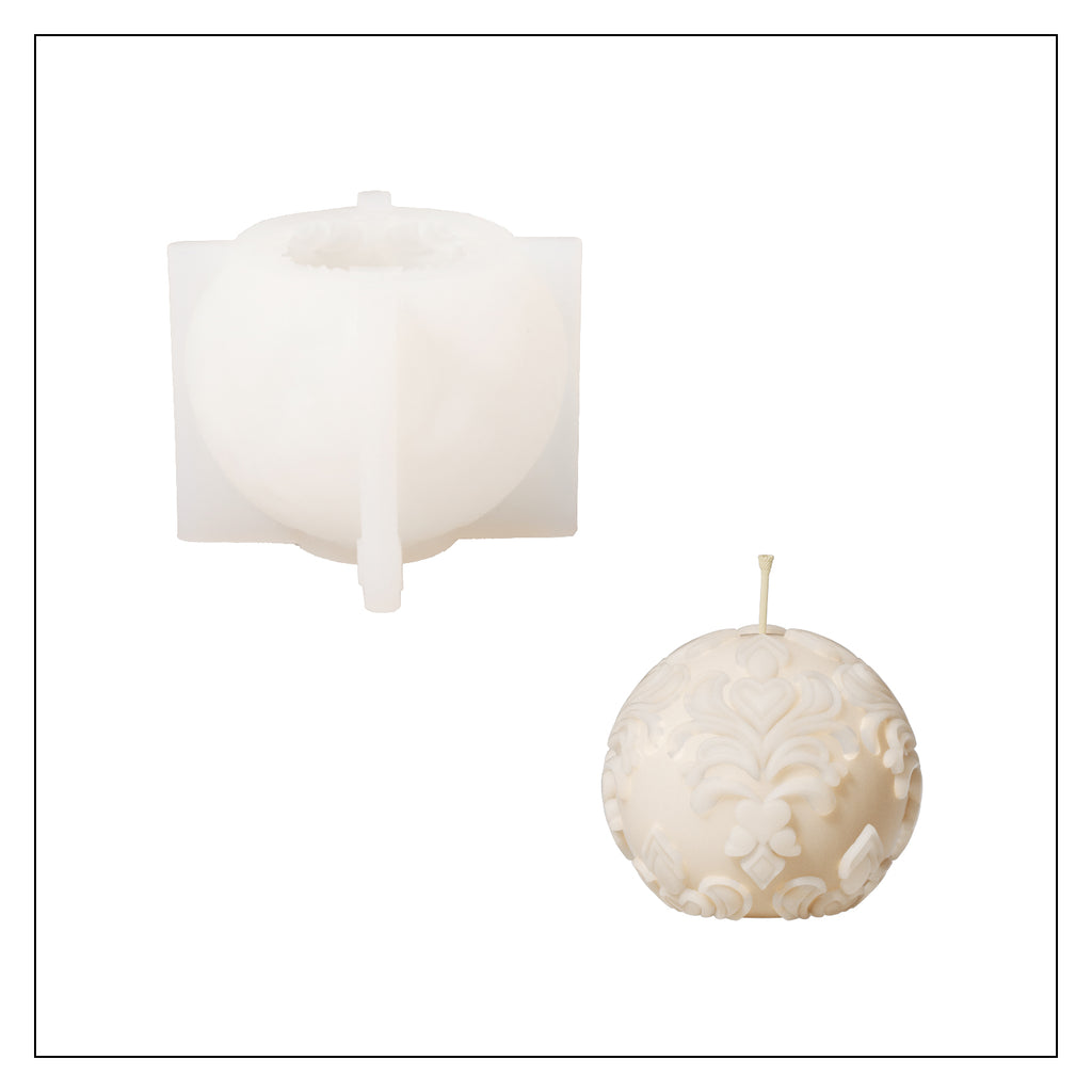 White silicone mold with a matching white sphere patterned relief candle.