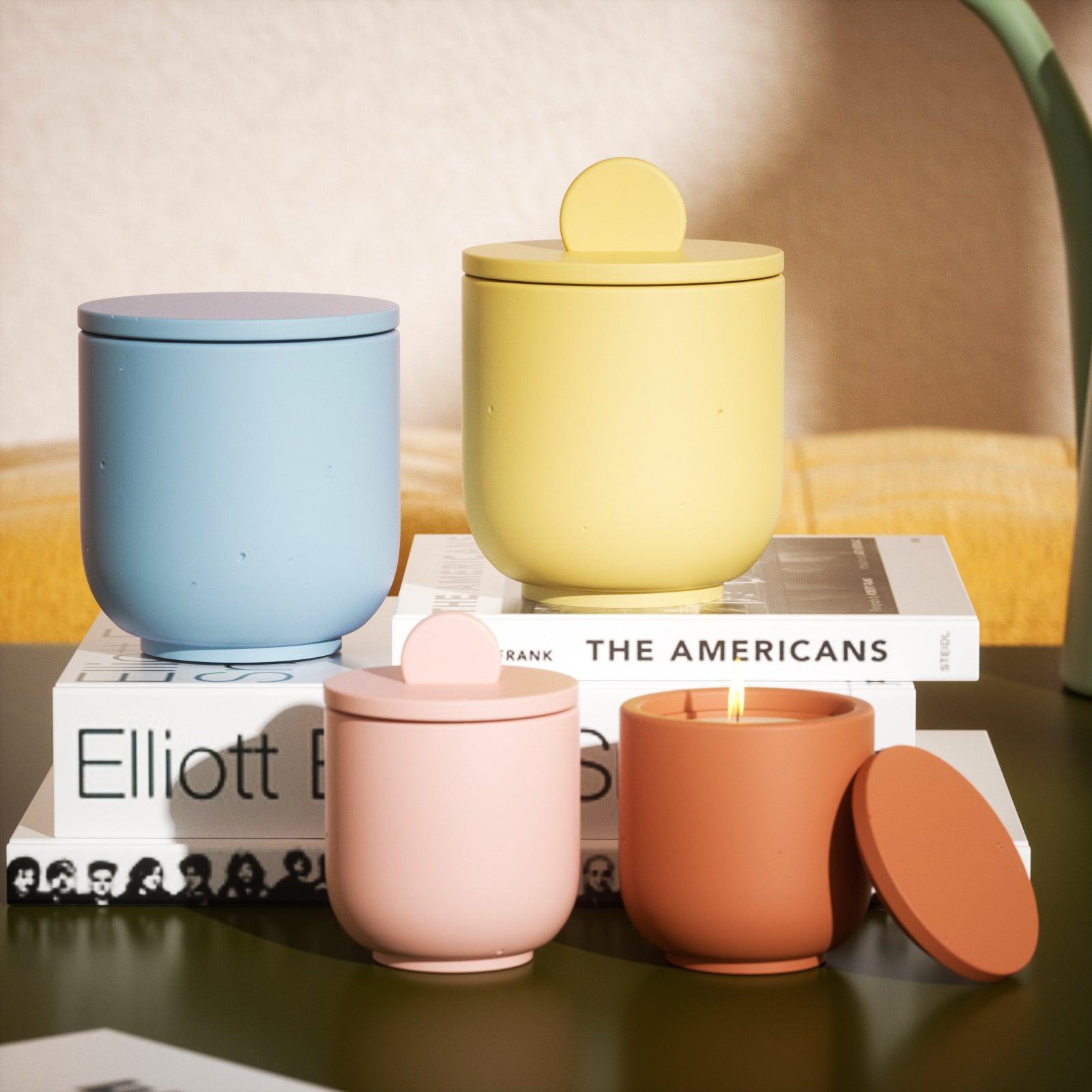 Flat and raised lid candle jars displayed on tabletop