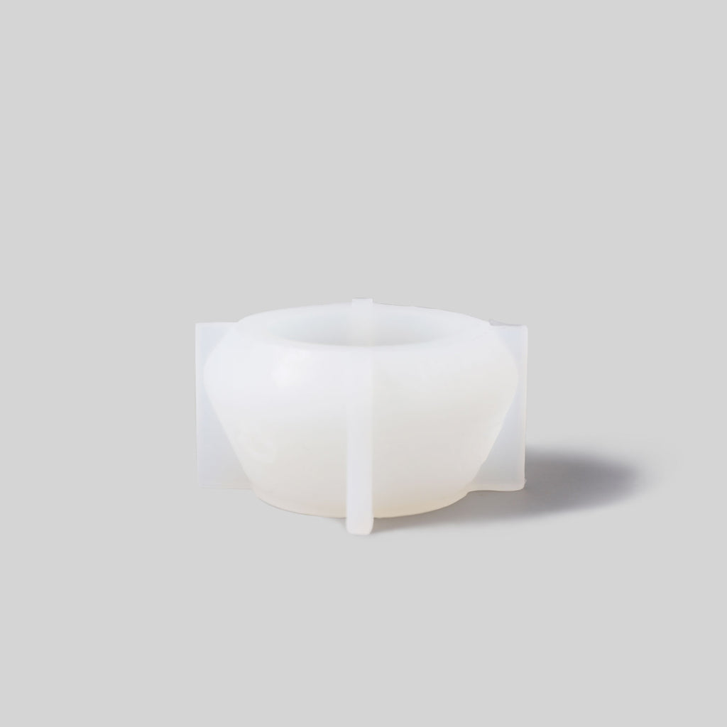 White tealight holder silicone mold, creating a fresh and stylish look.