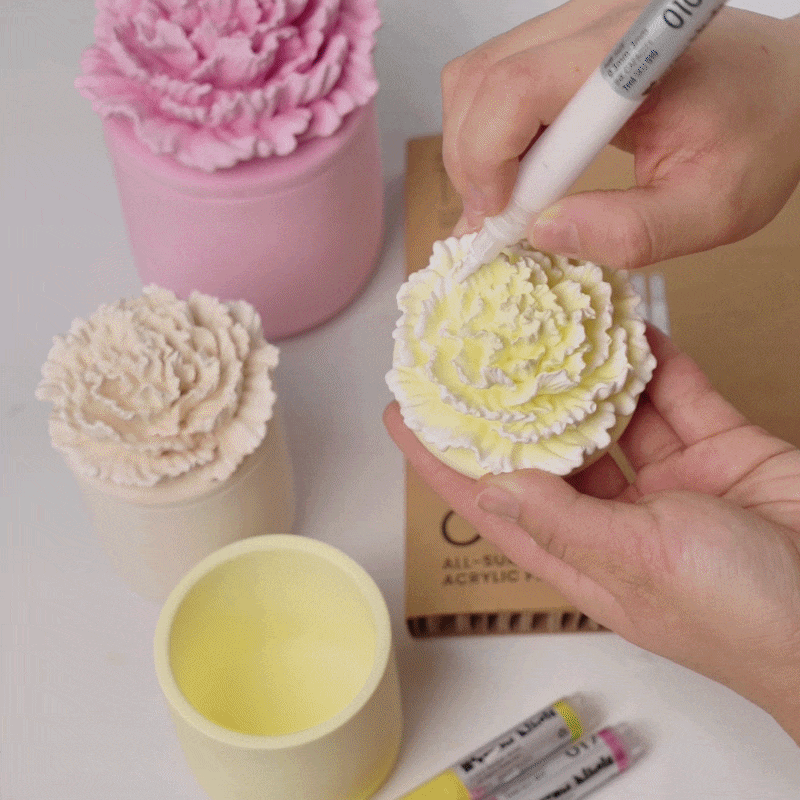 Detailed display of artisan outlining carnation patterns with a paintbrush -Boowan Nicole