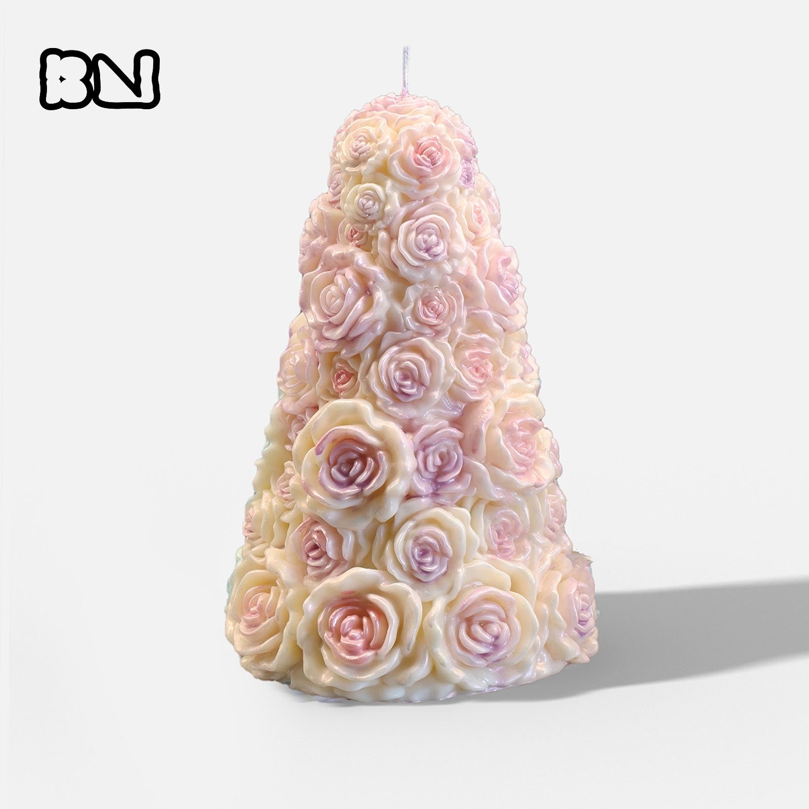 Pastel pink pearl rose tree pillar candle with layered sculpted roses standing on a white background - Boowan Nicole