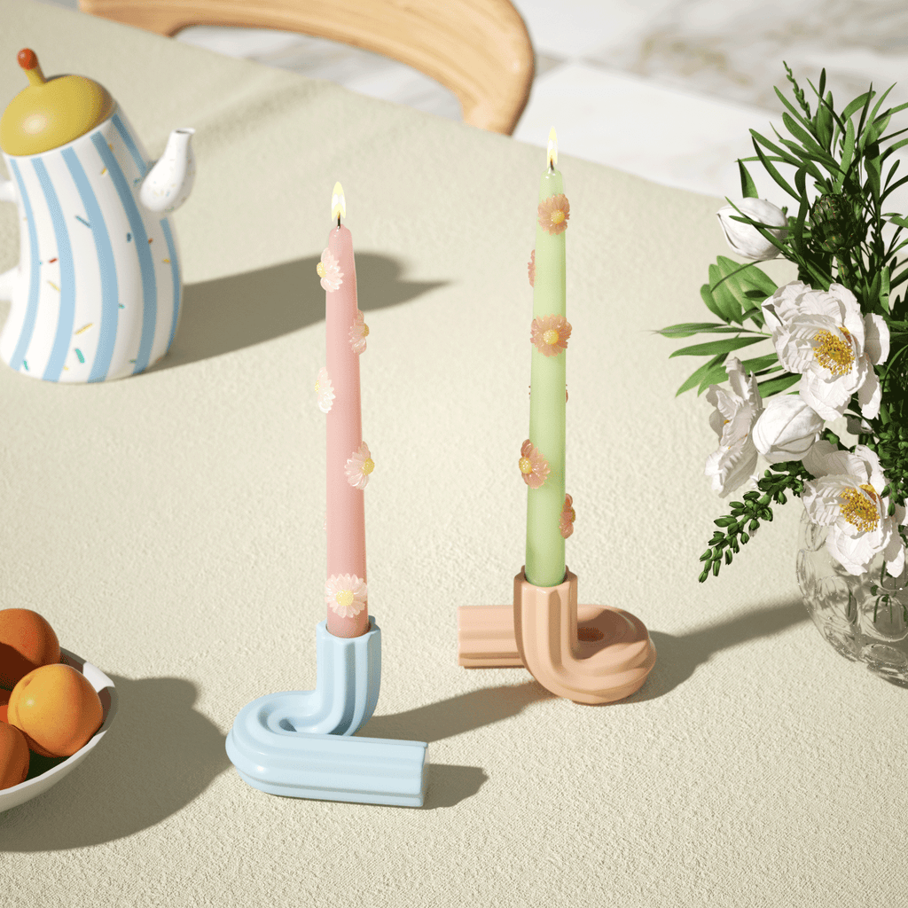 daisy delight candles with modern geometric holders, perfect for adding a colorful touch to any interior decor