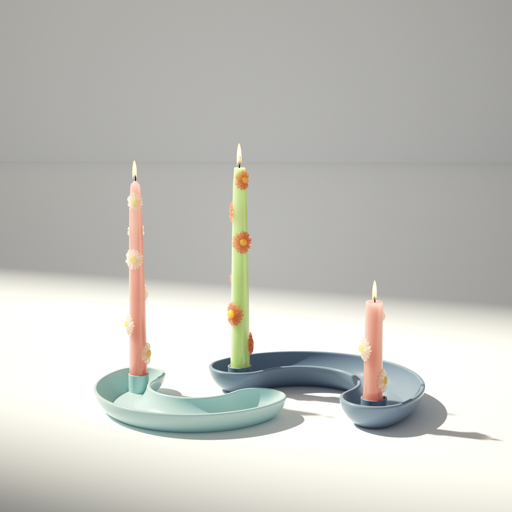 Elegant pastel daisy candles with unique wave-shaped holders, a modern floral accent for home interiors