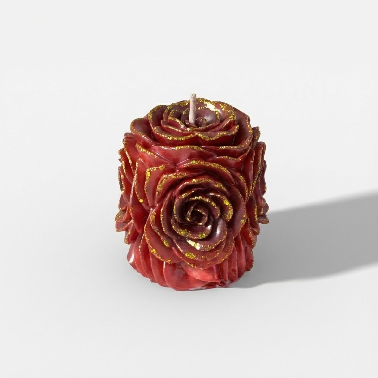 Dark red rose-shaped decorative candle with gold glittered petal edges - Boowan Nicole