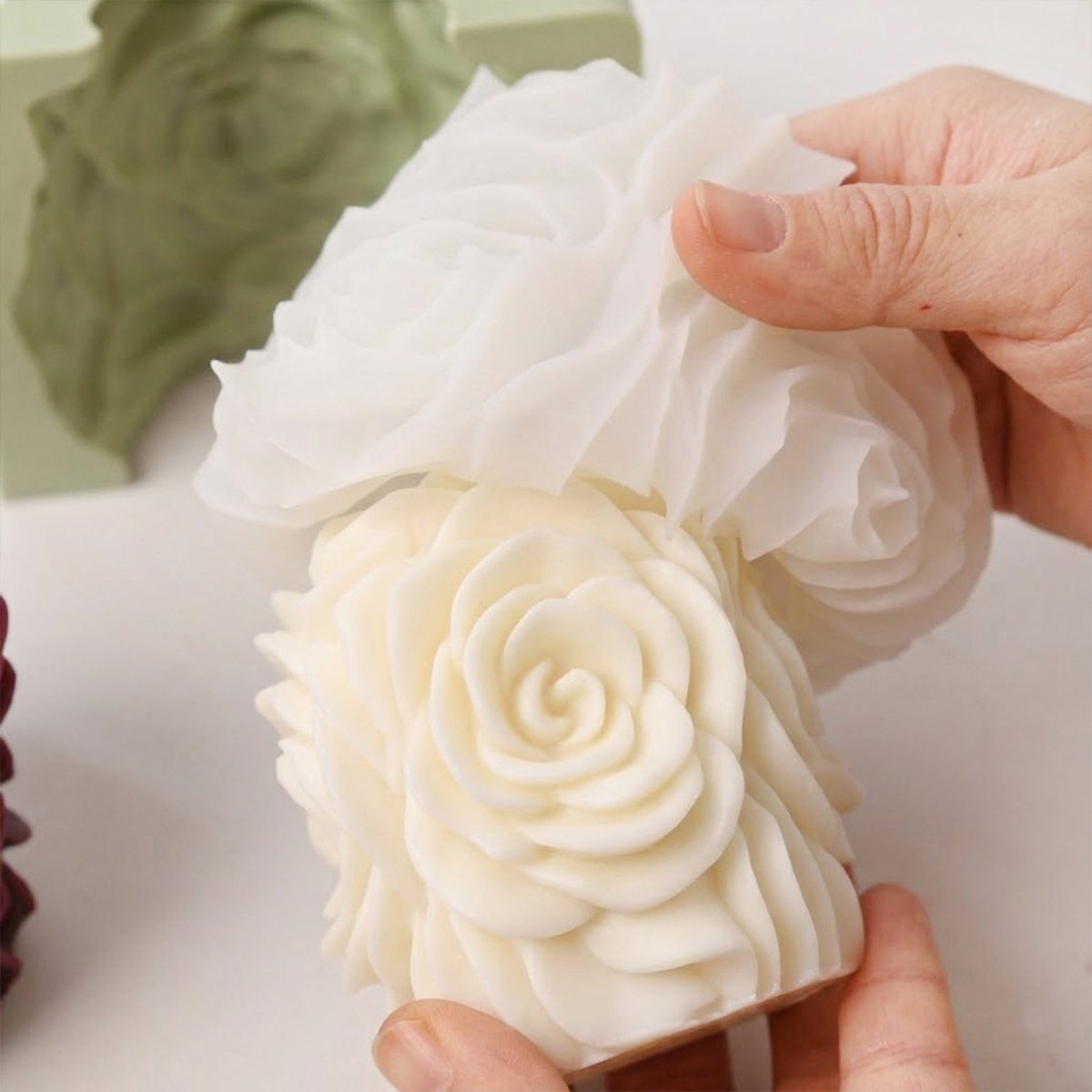 Demolding white rose pillar candle from flexible silicone mold. - Boowan Nicole
