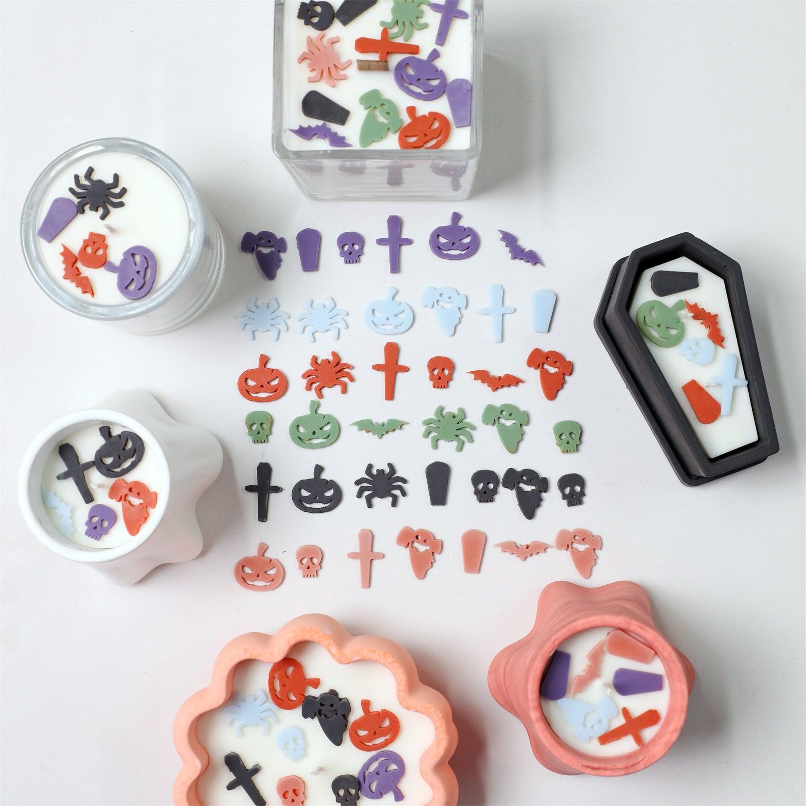 Colorful Halloween wax embellishments in ghost, pumpkin, bat, and skull shapes embedded in handmade candles jar - Boowan Nicole