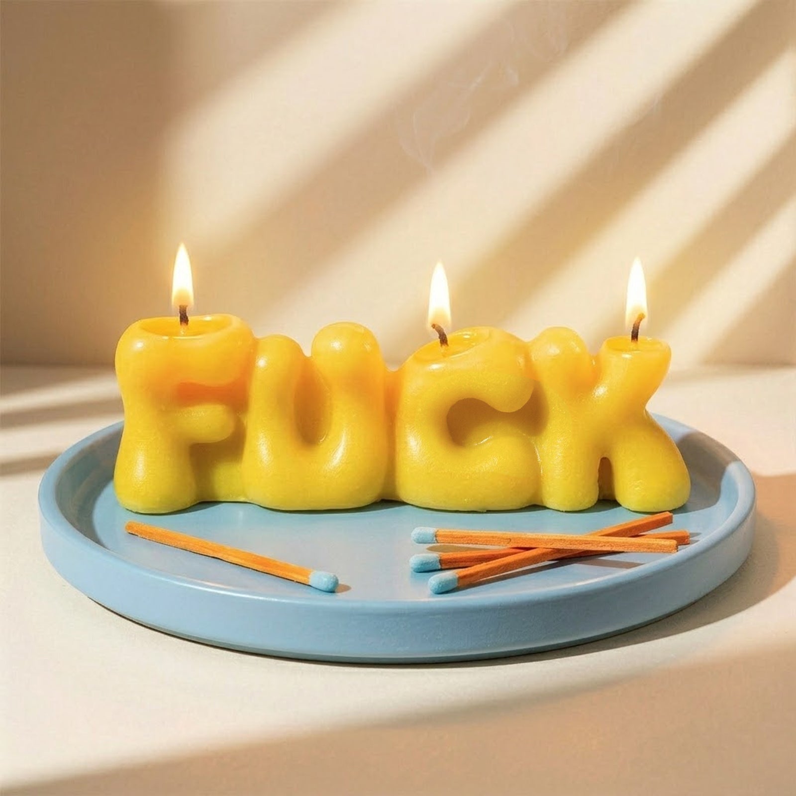 Close-up of Lit Pink FU & Green YO Bubble Letter Scented Candles - Boowan Nicole