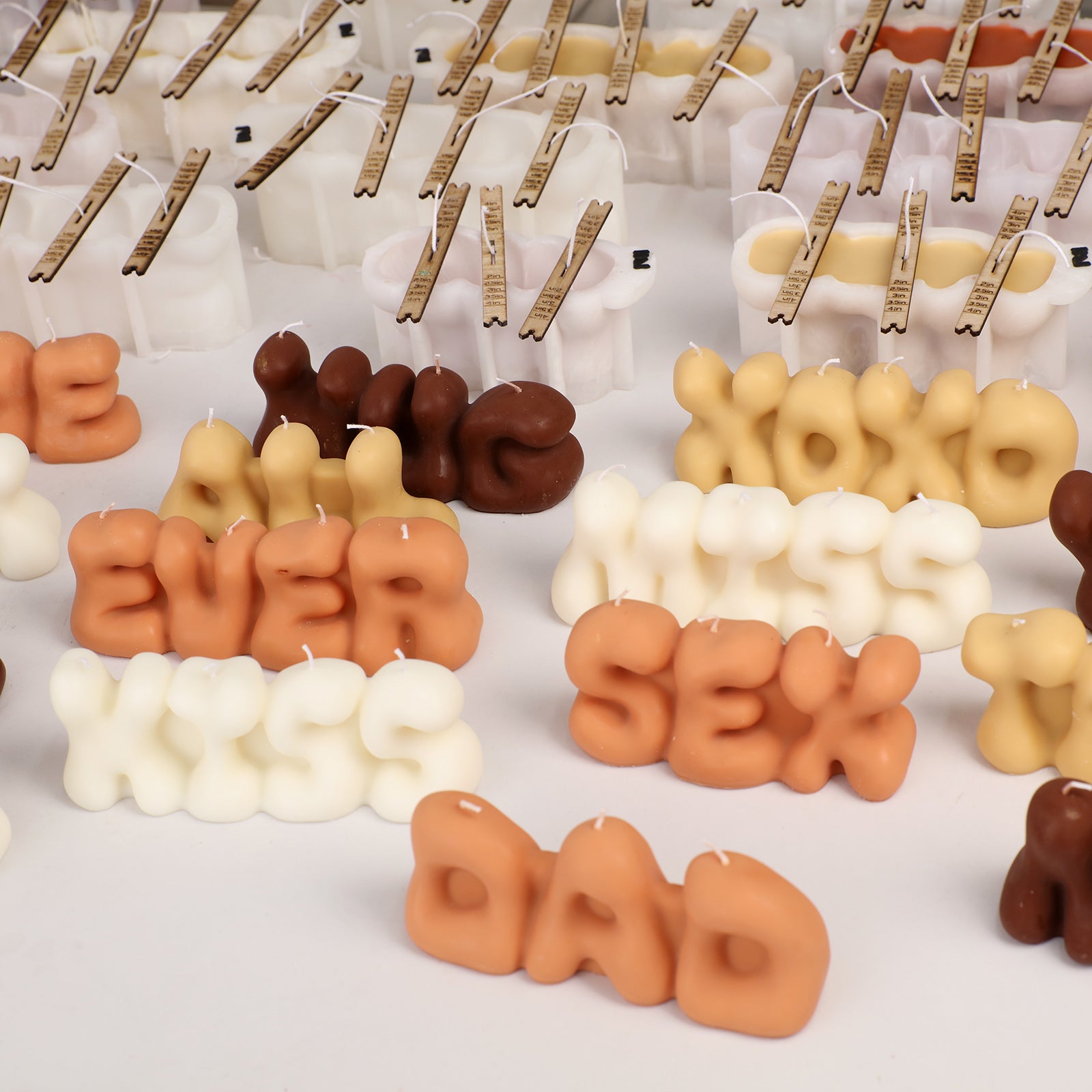 Lighting LOVE & DAD Bubble Letter Scented Candles on Stacked Books - Boowan Nicole