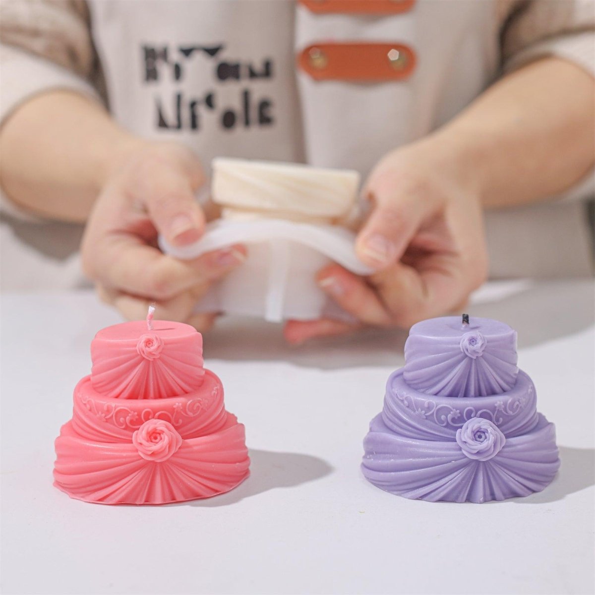 Display of Pink and Purple Rose Draped Cake Candles-Boowan Nicole