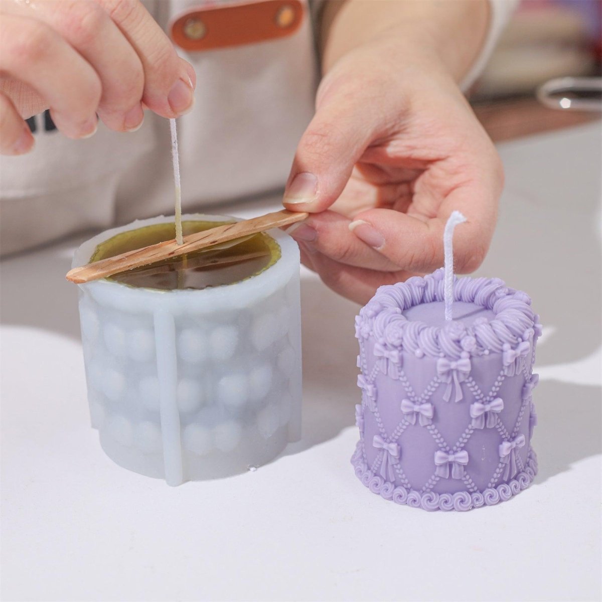 Use popsicle sticks to secure the wick in the mold, ensuring the cotton wick stays vertical for better burning performance-Boowan Nicole