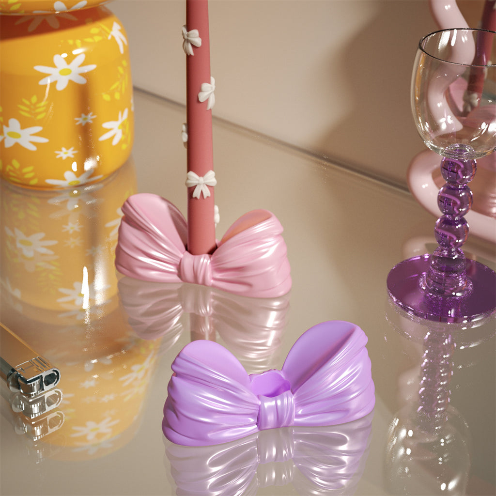 Chic bow-shaped candle holders in pastel pink and purple, ideal for elegant table decor or special celebrations-Boowan Nicole