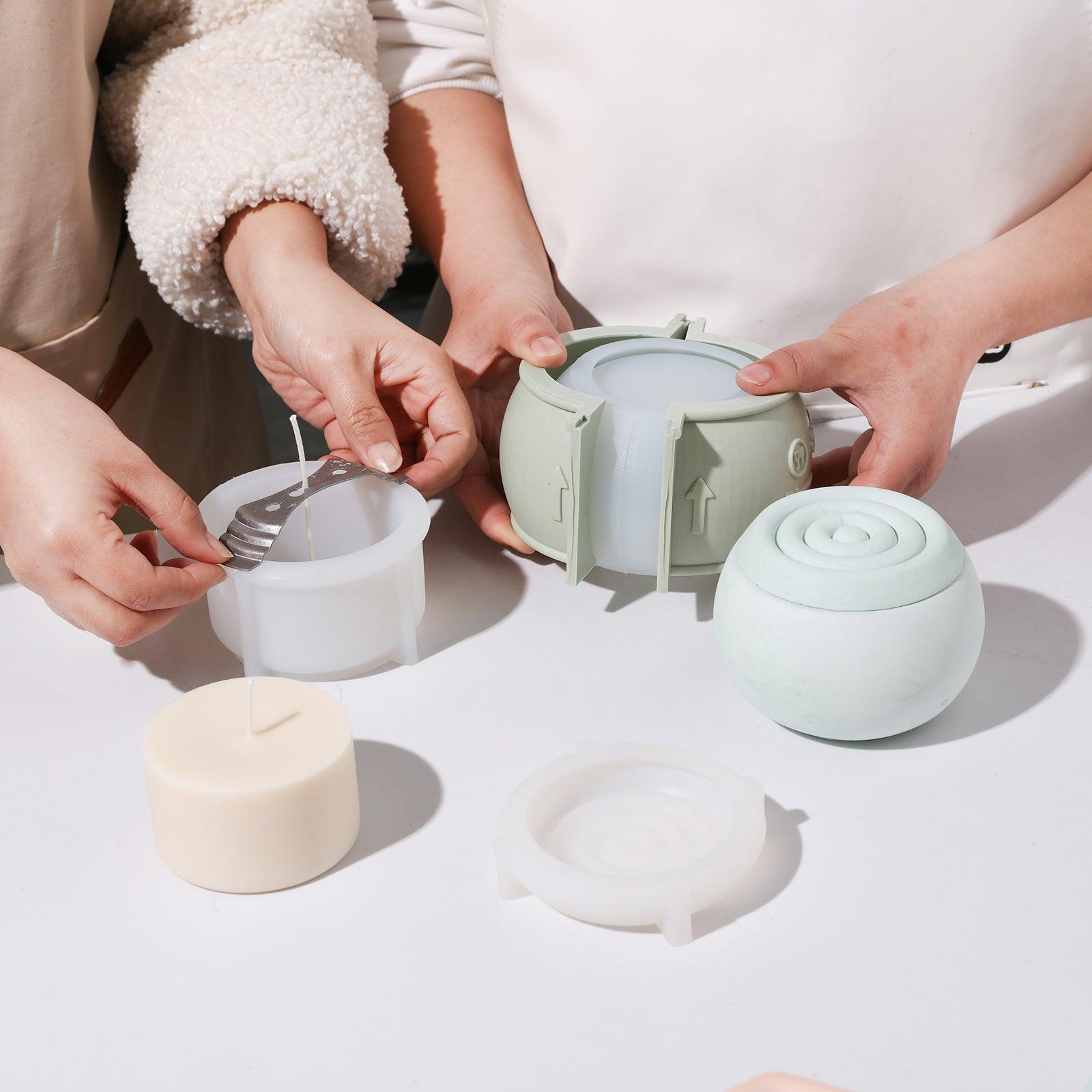 Displaying spherical candle jars and candle refills made using silicone molds.