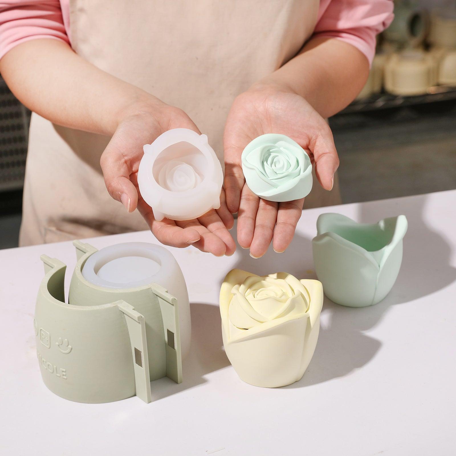 Hand holding lid and white silicone mold showing teal Rose Reverie Candle Jar - Boowan Nicole