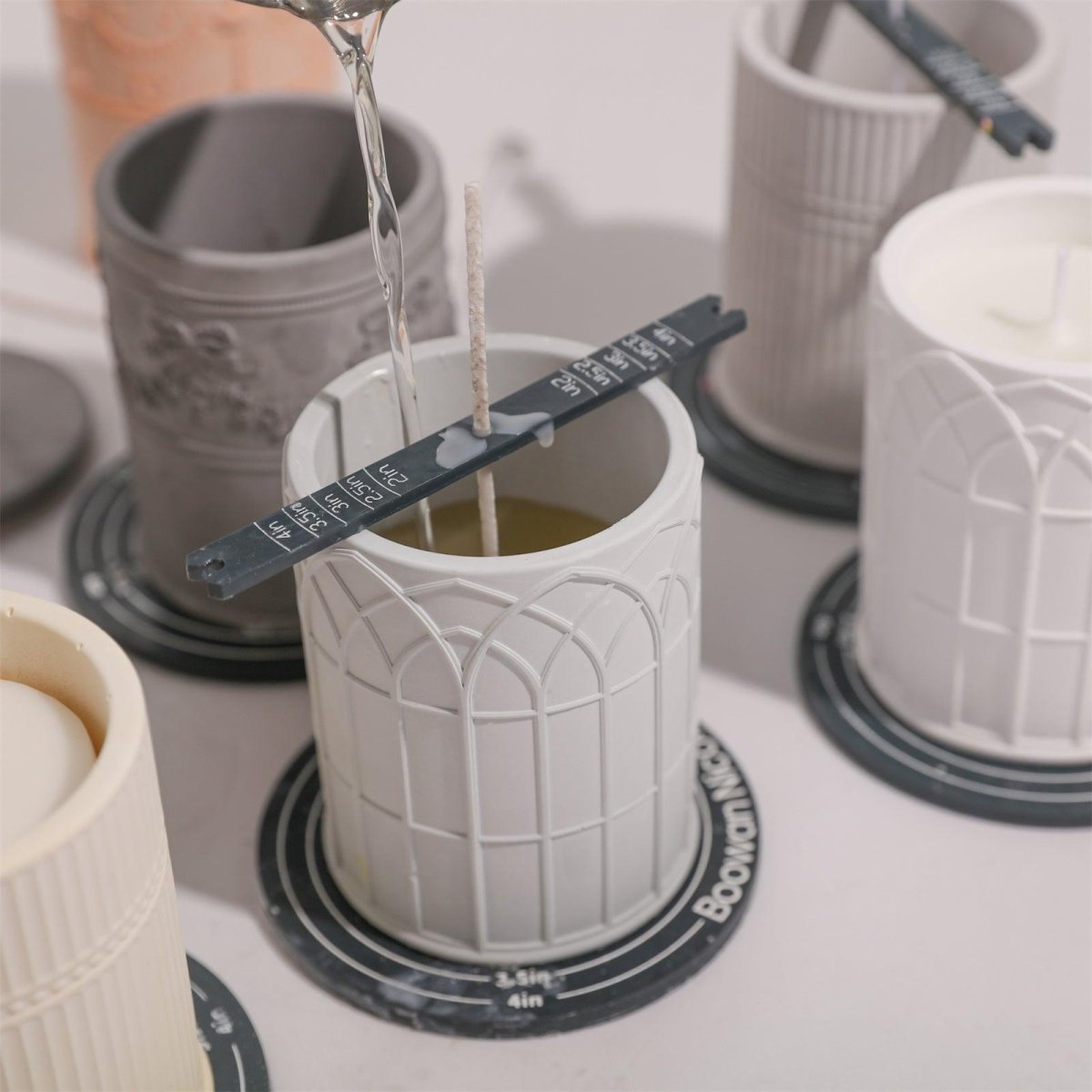 Filling a gray concrete candle jar with wax-Boowan Nicole