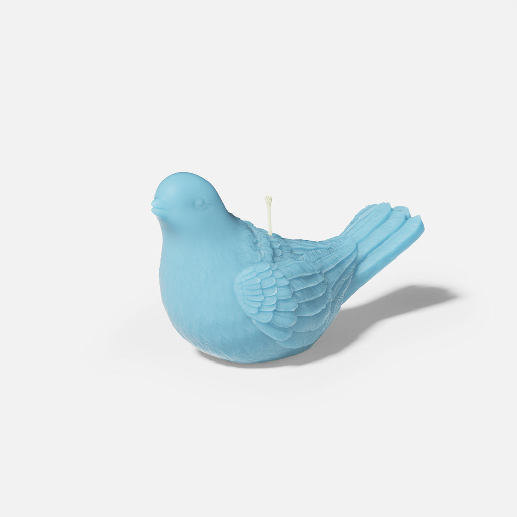 Blue dove-shaped tea light candle made from silicone mold, designed by Boowan Nicole.