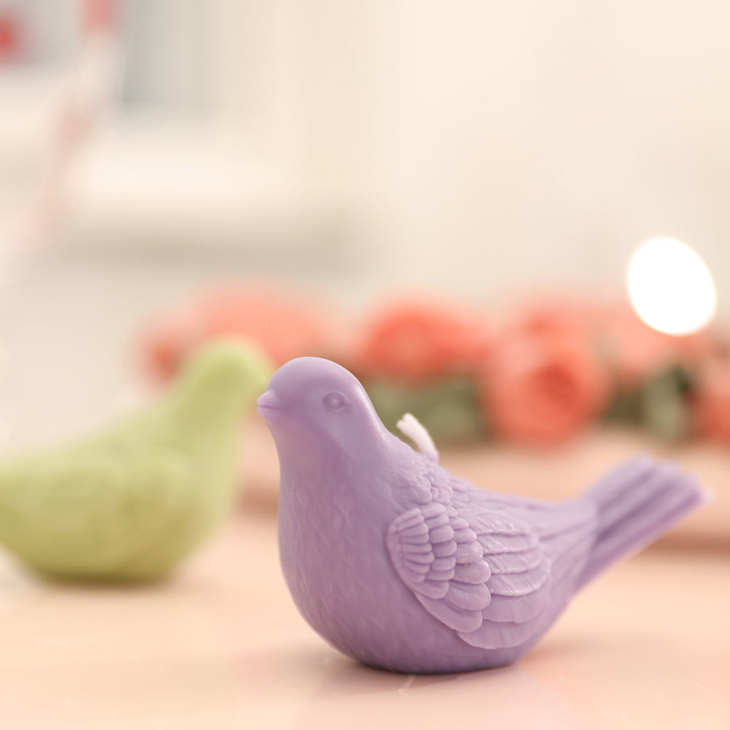 Purple peace dove-shaped tea light candle, close-up shot, precision mold design, and smart finished product shape, designed by Boowan Nicole.
