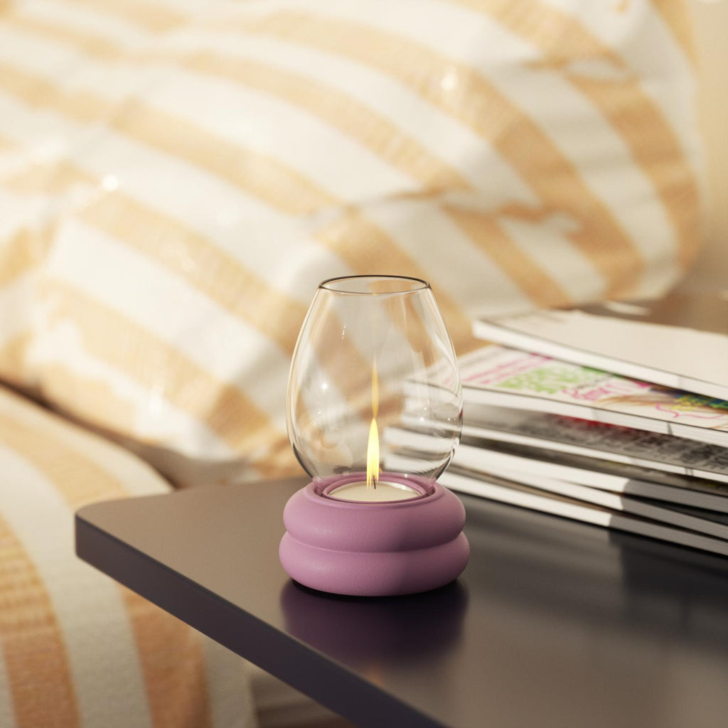 Purple candle holder quietly placed on the table