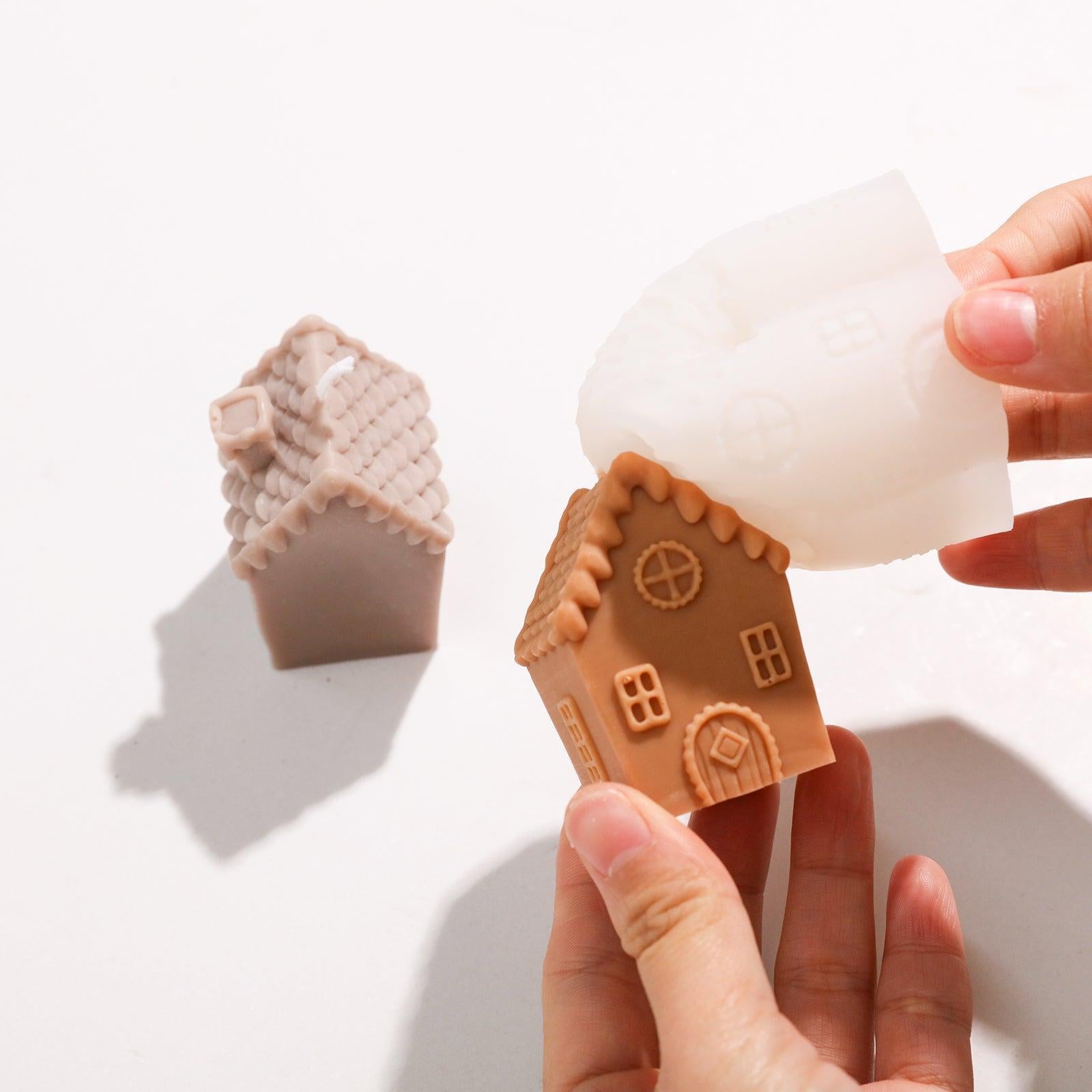 The finished single chimney house candle comes out of the silicone mold.