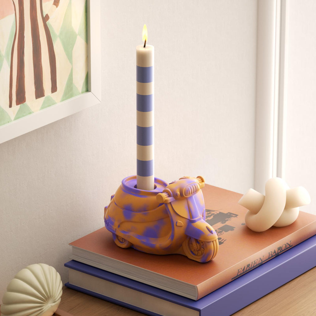 Handcrafted car candle holder in vibrant purple and orange with striped taper candle-Boowan Nicole