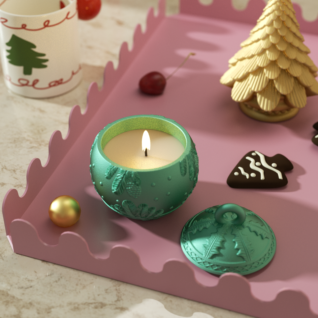 The lit green candle jar with an embossed feather design fills Christmas with a festive atmosphere-Boowan Nicole