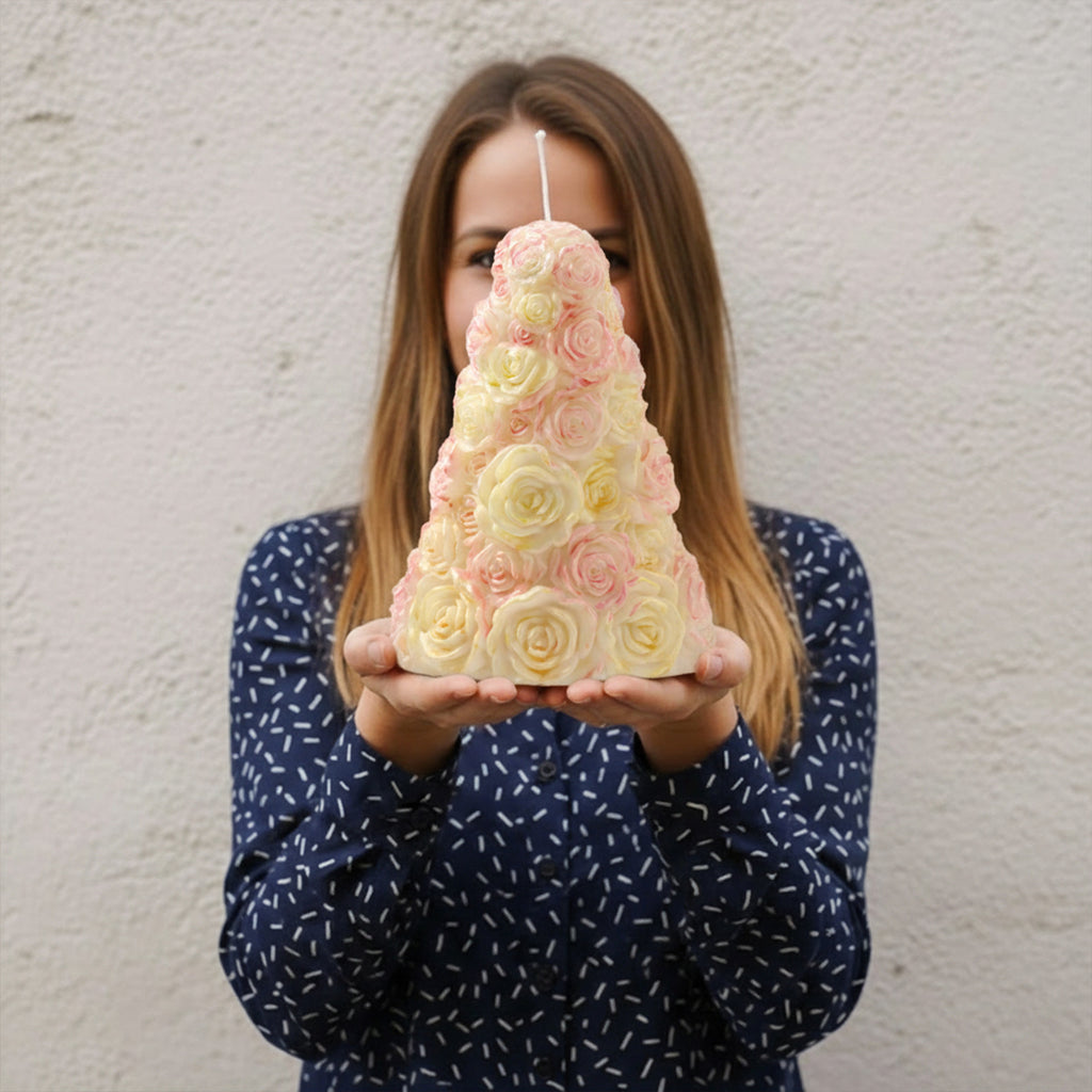 Woman holding a large pastel rose tree pillar candle made with a rose tree candle silicone mold - Boowan Nicole